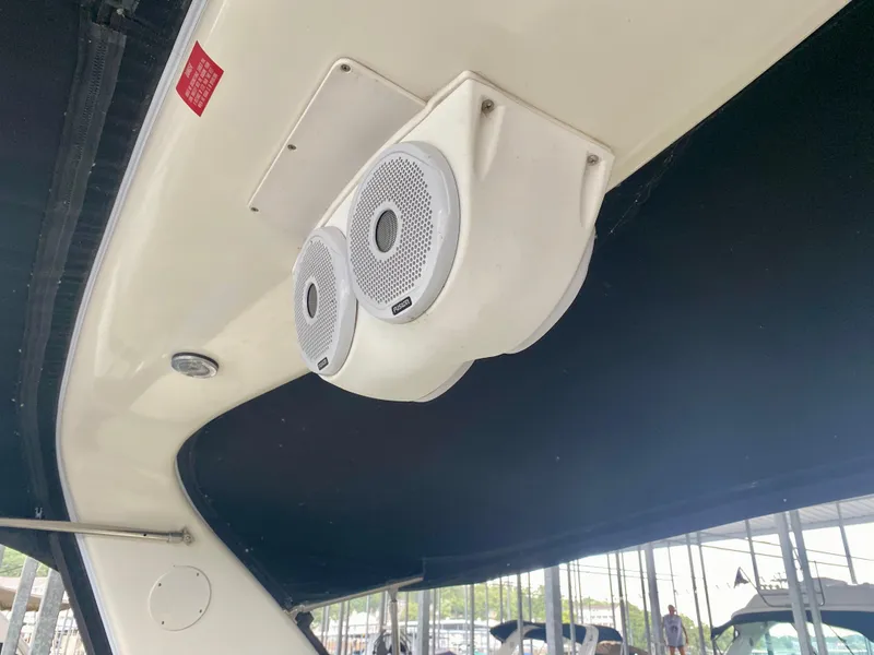 Slide: The Image of Speakers on a 1999 Sea Ray 400 Sundancer boat, under a black canopy. - 13