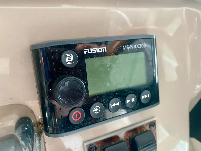 Slide: The Image of Fusion MS-NRX300 marine stereo on 1999 Sea Ray 400 Sundancer boat dashboard. - 16
