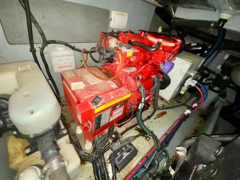 Slide: The Image of Engine room of 1999 Sea Ray 400 Sundancer with red generator and wiring. - 33