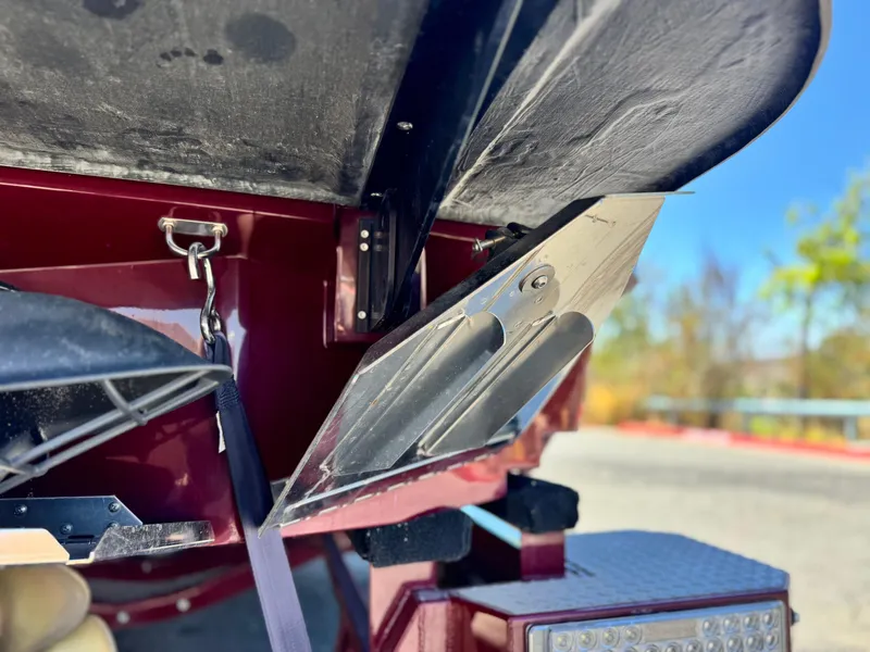 Slide: The Image of Close-up of 2022 MasterCraft XStar S boat hull and hardware. - 10