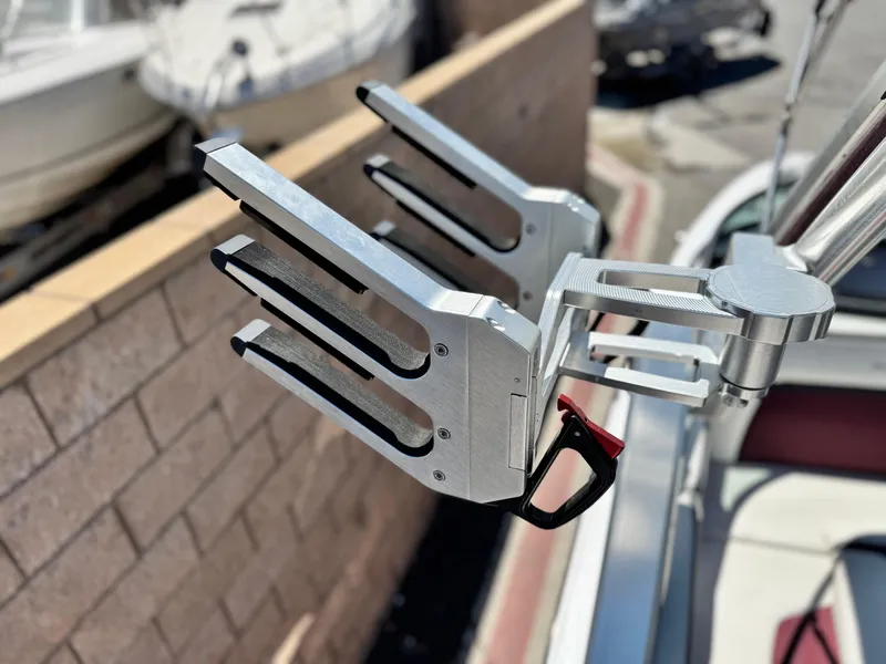 Slide: The Image of 2022 MasterCraft XStar S wakeboard rack, silver finish, mounted on boat. - 14