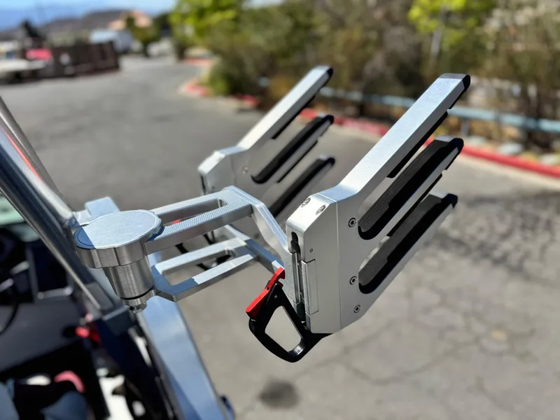 Slide: The Image of 2022 MasterCraft XStar S wakeboard rack, close-up view, outdoors. - 15