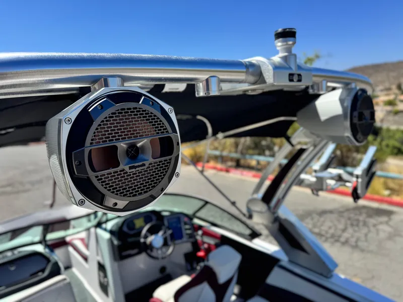 Slide: The Image of 2022 MasterCraft XStar S boat with premium audio speakers and sleek interior design. - 16