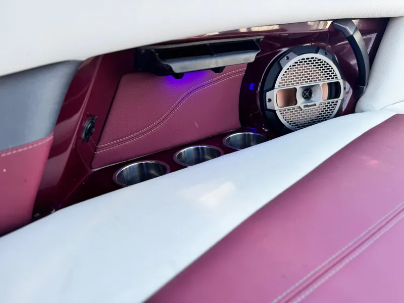 Slide: The Image of Interior of 2022 MasterCraft XStar S with speaker and cup holders. - 26