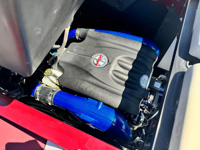 Slide: The Image of 2022 MasterCraft XStar S engine with blue accents, showcasing powerful performance components. - 34