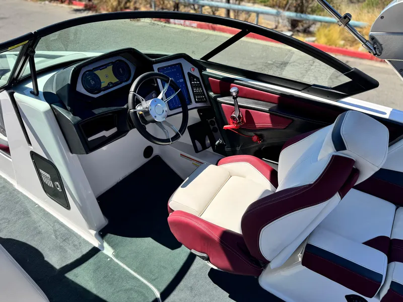 Slide: The Image of Interior of 2022 MasterCraft XStar S boat with modern dashboard and luxurious seating. - 39