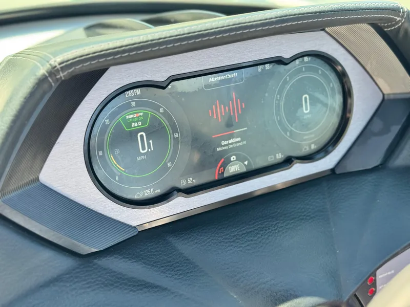 Slide: The Image of 2022 MasterCraft XStar S dashboard displaying speed and music controls. - 41