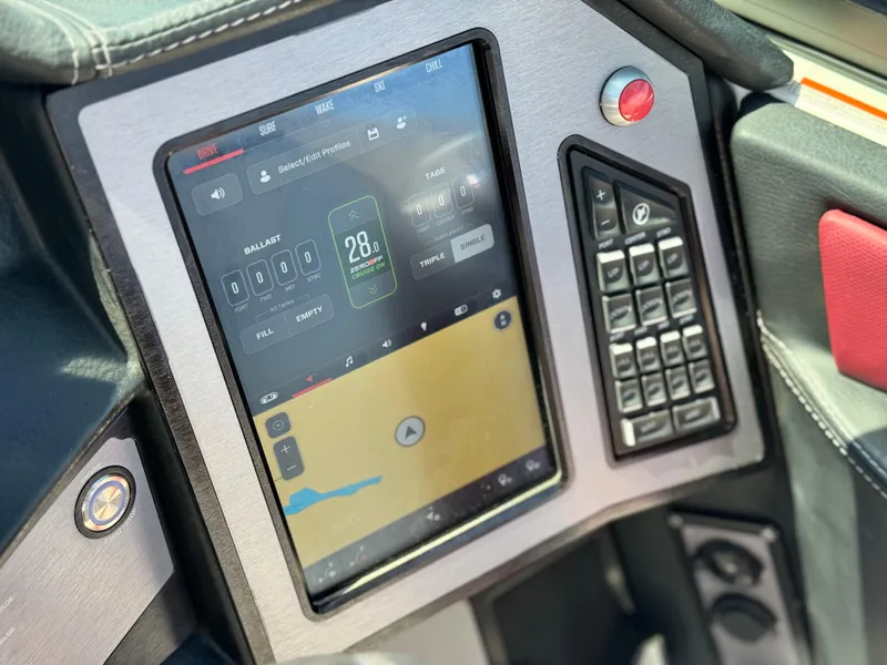 Slide: The Image of 2022 MasterCraft XStar S dashboard with touchscreen controls and navigation display. - 42