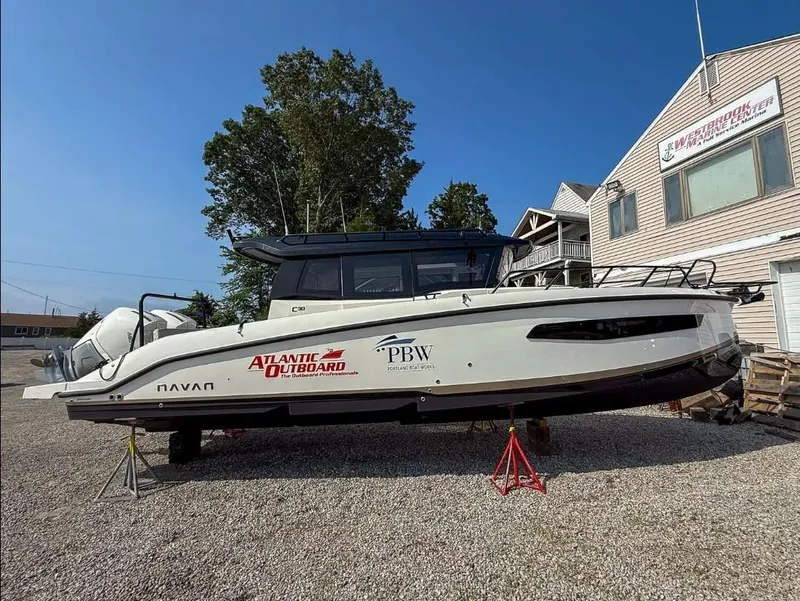 Slide: The Image of Navan C30 2025 boat on display at Westbrook Marine Center, supported by stands. - 10