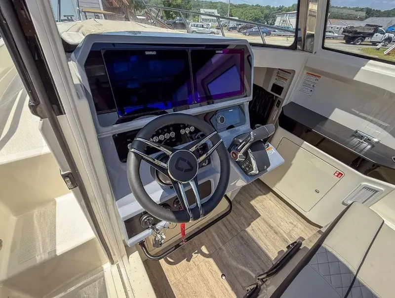 Slide: The Image of Interior view of 2025 Navan C30 boat cockpit with modern steering and navigation system. - 15