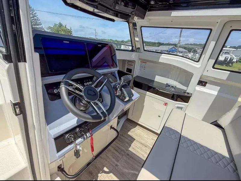 Slide: The Image of Interior of 2025 Navan C30 boat with modern steering and navigation system. - 24