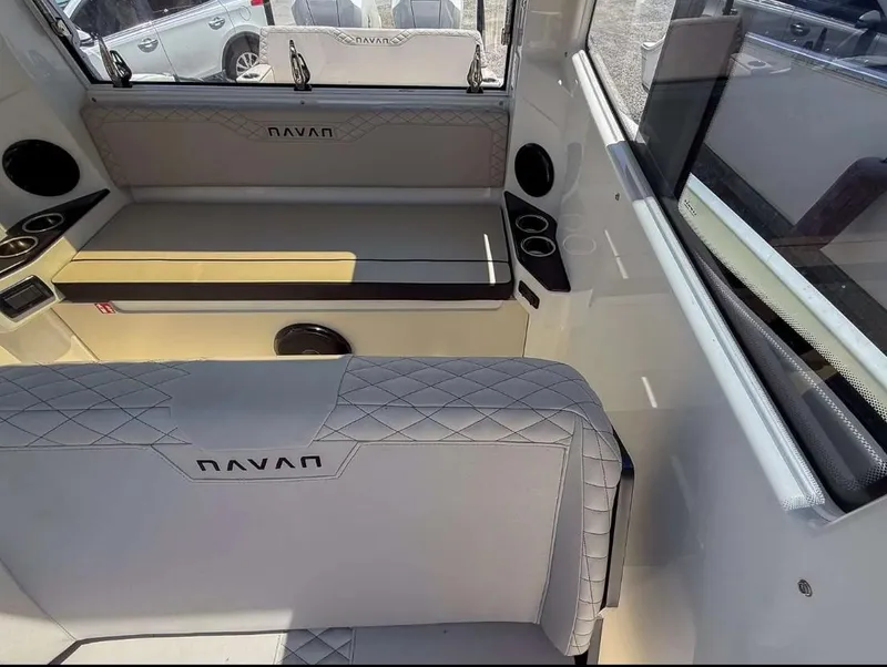 Slide: The Image of Interior of 2025 Navan C30 boat with quilted seating and cup holders. - 27