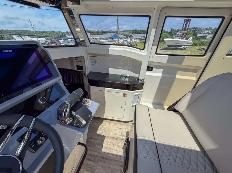 Slide: The Image of Interior of 2025 Navan C30 boat with modern controls and seating. - 28