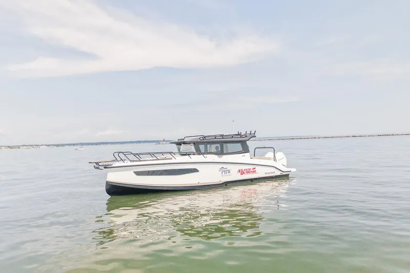 Slide: The Image of 2025 Navan C30 boat on calm water under a clear sky. - 3