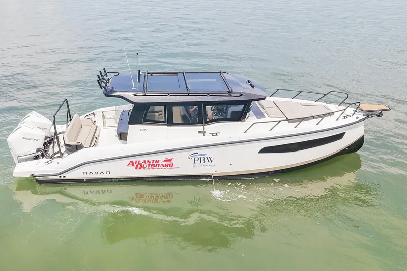 Slide: The Image of 2025 Navan C30 boat on water, featuring sleek design and modern outboard engine. - 5