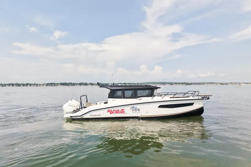 Slide: The Image of 2025 Navan C30 boat on calm water under a clear sky. - 6