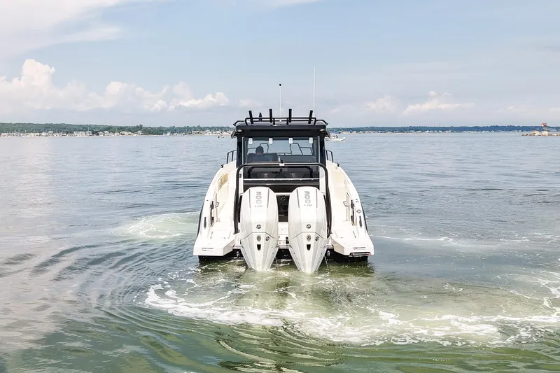 Slide: The Image of 2025 Navan C30 boat cruising on a calm lake under a clear sky. - 9
