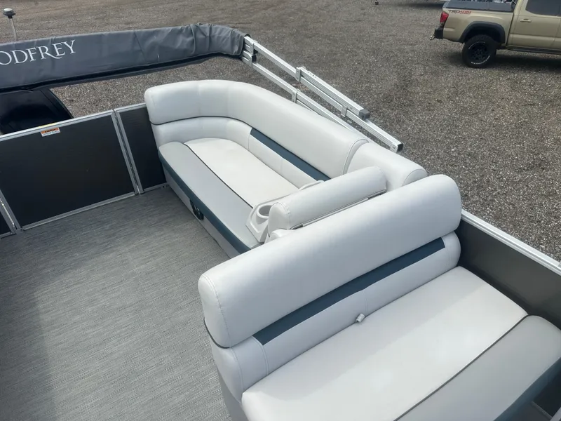 Slide: The Image of 2022 Godfrey SWEETWATER 2286 SB pontoon boat with white seating and gray flooring. - 12