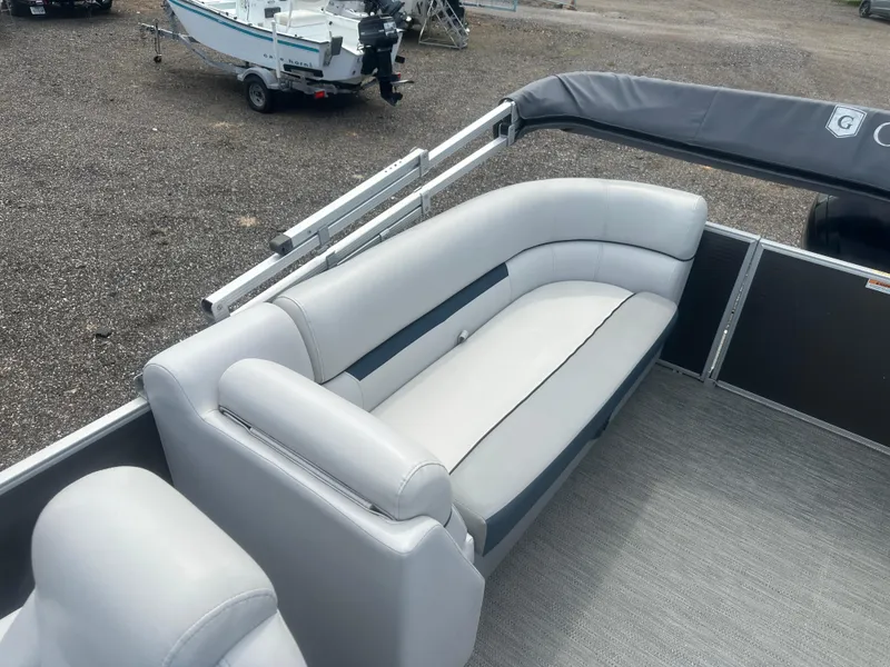 Slide: The Image of 2022 Godfrey SWEETWATER 2286 SB pontoon boat with gray seating and carpeted deck. - 13