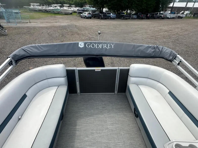 Slide: The Image of 2022 Godfrey SWEETWATER 2286 SB pontoon boat interior with seating and canopy. - 14