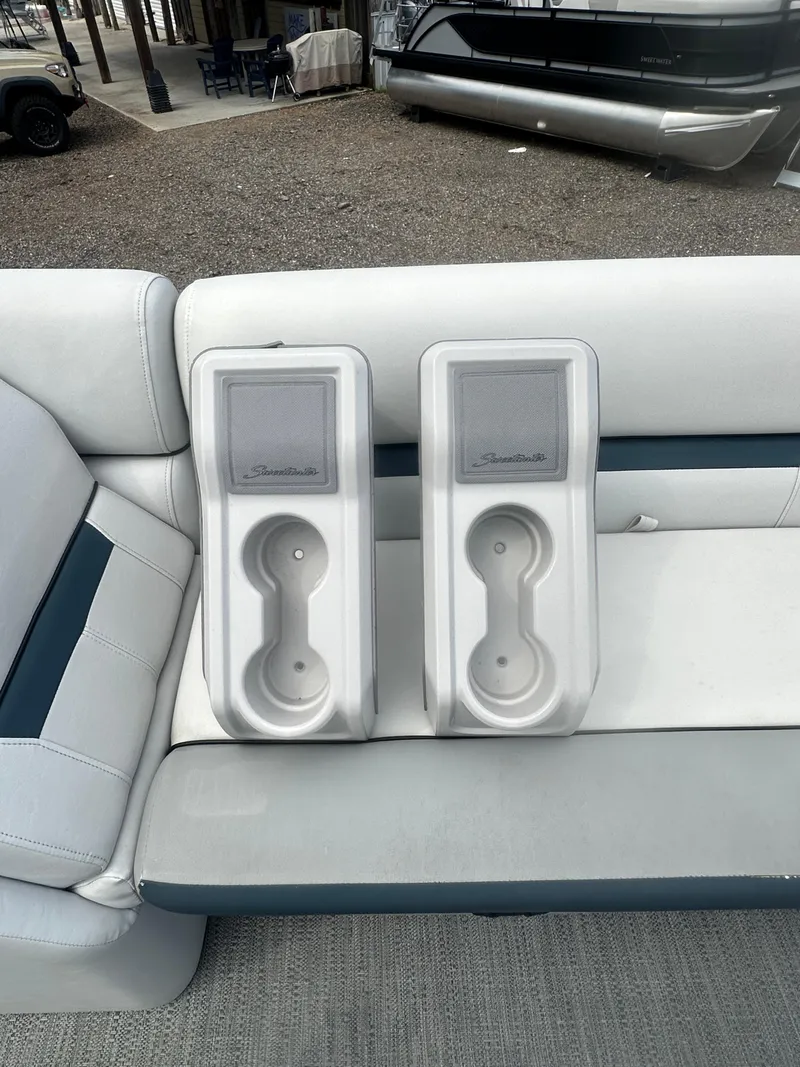 Slide: The Image of 2022 Godfrey SWEETWATER 2286 SB boat interior with cup holders on white seating. - 20