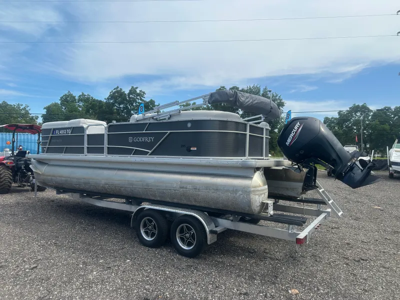 Slide: The Image of 2022 Godfrey SWEETWATER 2286 SB pontoon boat on trailer with Mercury outboard motor. - 3