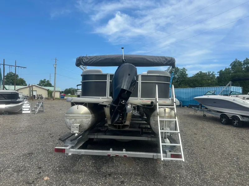 Slide: The Image of 2022 Godfrey SWEETWATER 2286 SB pontoon boat on trailer, parked outdoors. - 4