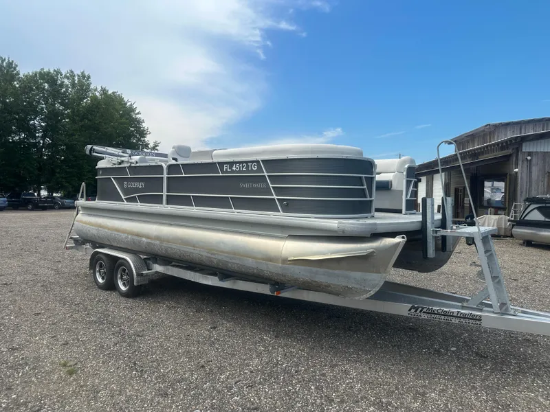 Slide: The Image of 2022 Godfrey SWEETWATER 2286 SB pontoon boat on trailer, parked outdoors. - 7