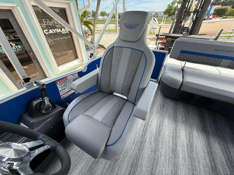 Slide: The Image of Captain's chair in 2026 Bennington 22 MSB boat, featuring sleek gray upholstery and modern design. - 14