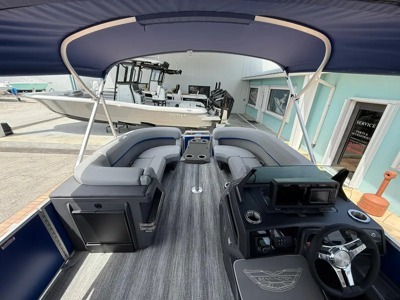 Slide: The Image of 2026 Bennington 22 MSB pontoon boat interior with modern seating and helm. - 16