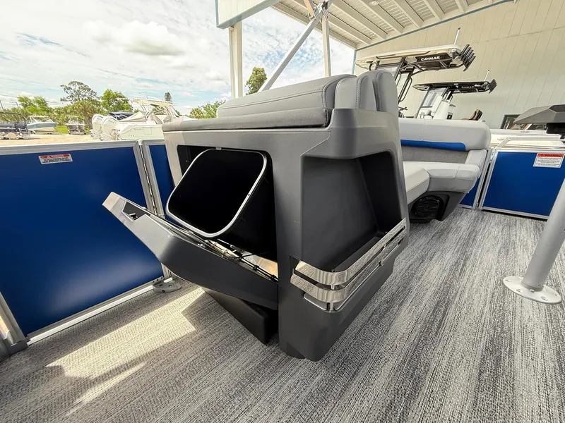Slide: The Image of 2026 Bennington 22 MSB boat interior with open storage compartment and seating area. - 18