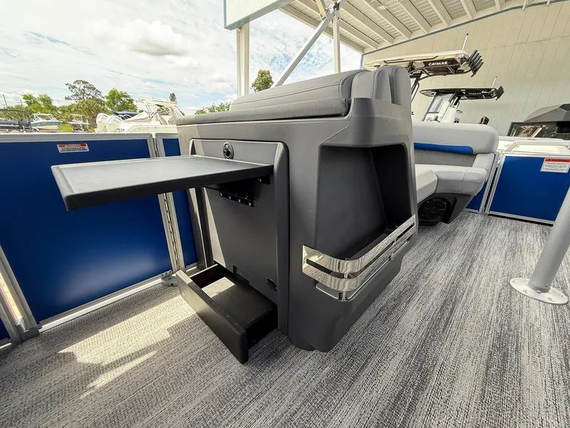 Slide: The Image of 2026 Bennington 22 MSB pontoon boat interior with seating and storage features. - 19