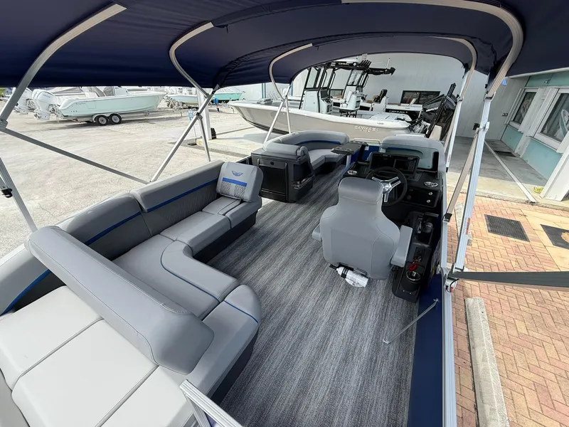 Slide: The Image of 2026 Bennington 22 MSB pontoon boat interior with gray seating and modern helm. - 8