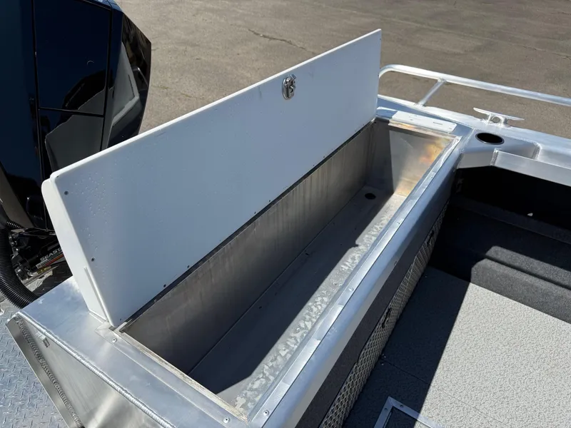 Slide: The Image of Open storage compartment on 2025 Thunder Jet 210 Luxor boat, showcasing spacious interior. - 12
