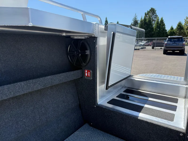 Slide: The Image of 2025 Thunder Jet 210 Luxor boat interior with speaker and storage compartment. - 13