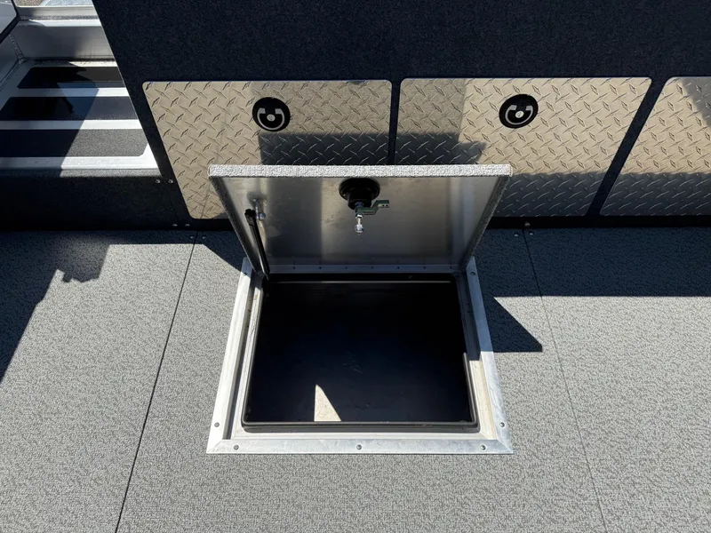 Slide: The Image of Open storage compartment on 2025 Thunder Jet 210 Luxor boat deck. - 14