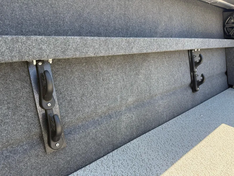 Slide: The Image of Interior of 2025 Thunder Jet 210 Luxor boat, featuring carpeted storage area. - 16