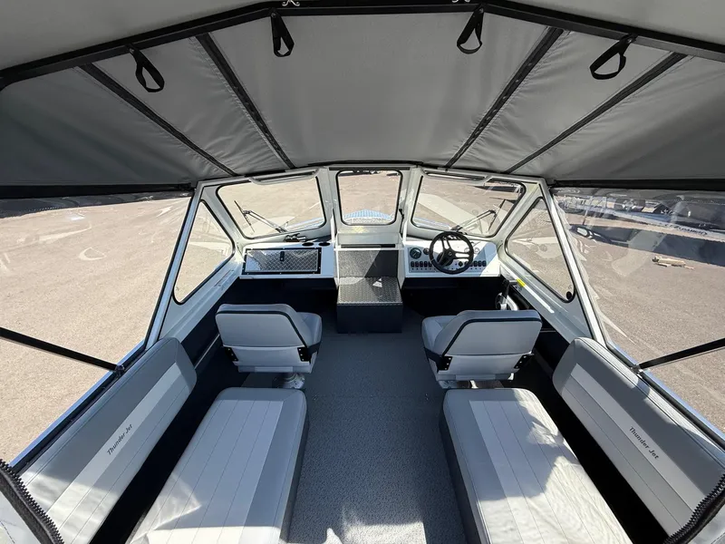 Slide: The Image of Interior of 2025 Thunder Jet 210 Luxor boat with seating and steering wheel. - 17