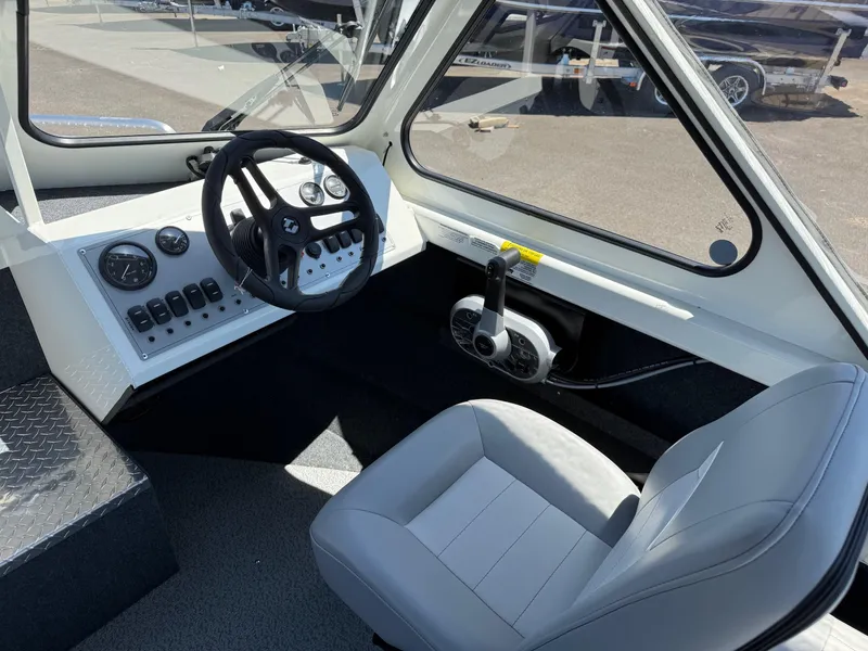 Slide: The Image of Interior cockpit of 2025 Thunder Jet 210 Luxor boat with steering wheel and controls. - 22