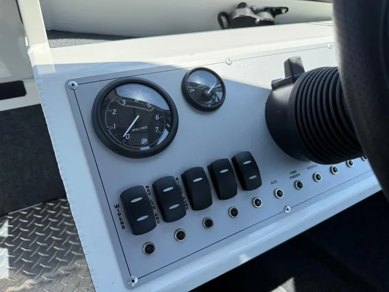 Slide: The Image of Dashboard of 2025 Thunder Jet 210 Luxor boat with gauges and switches. - 23