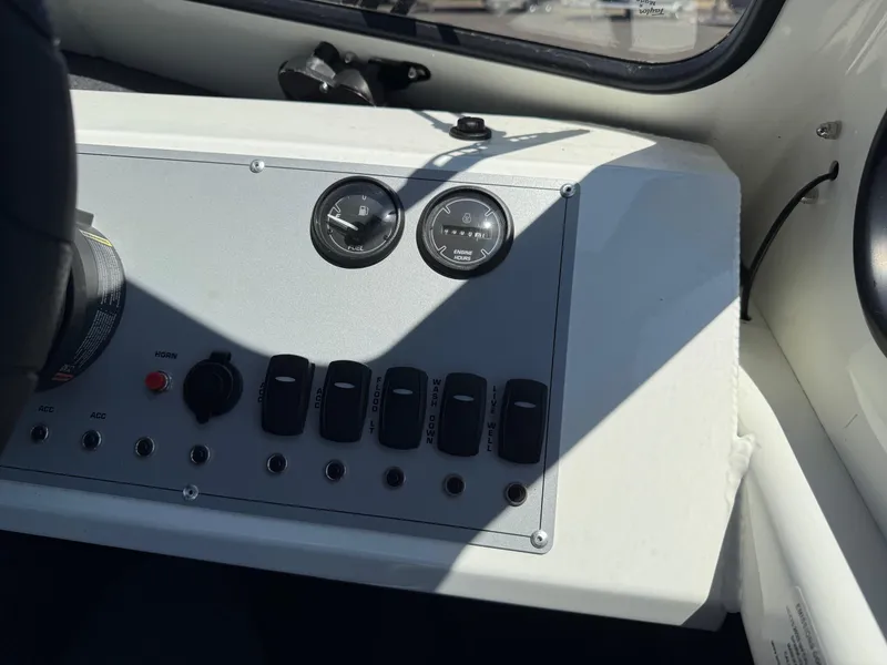 Slide: The Image of Control panel of 2025 Thunder Jet 210 Luxor boat with gauges and switches. - 24
