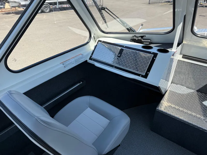 Slide: The Image of Interior of 2025 Thunder Jet 210 Luxor boat with seating and dashboard. - 25