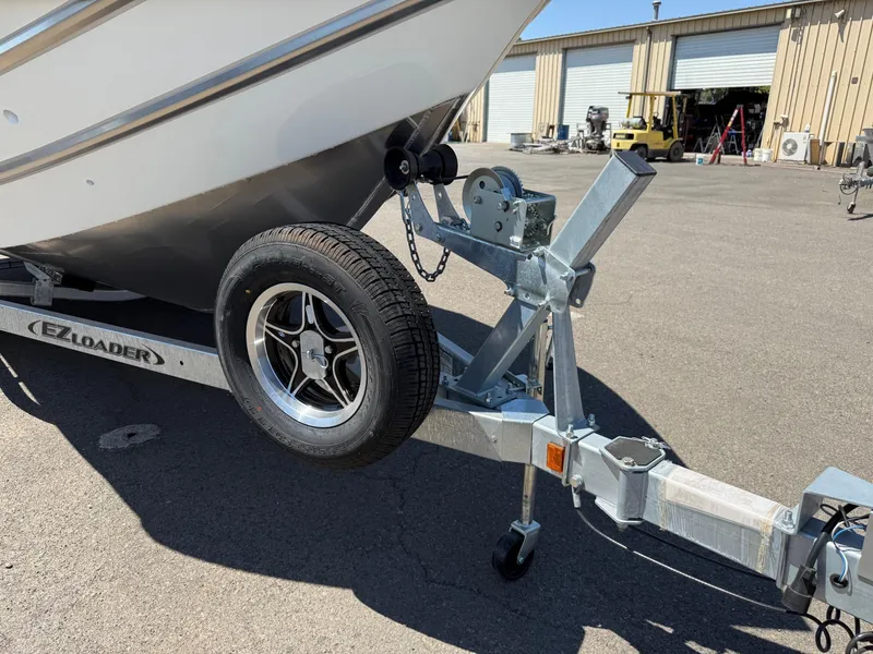 Slide: The Image of Trailer for 2025 Thunder Jet 210 Luxor boat in a parking lot. - 33