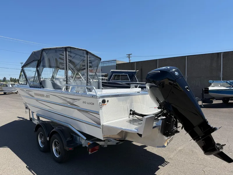 Slide: The Image of 2025 Thunder Jet 210 Luxor boat with outboard motor on trailer. - 4