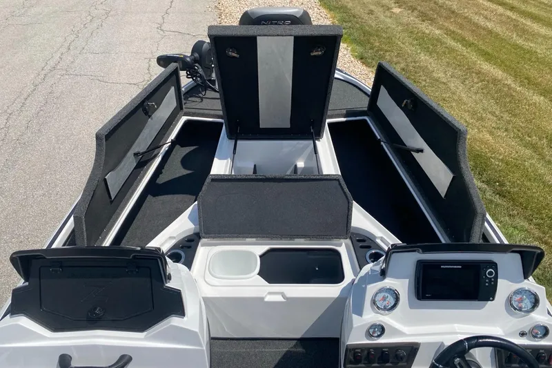 Slide: The Image of 2021 Nitro Z18 Pro boat interior with open storage compartments and control panel. - 3