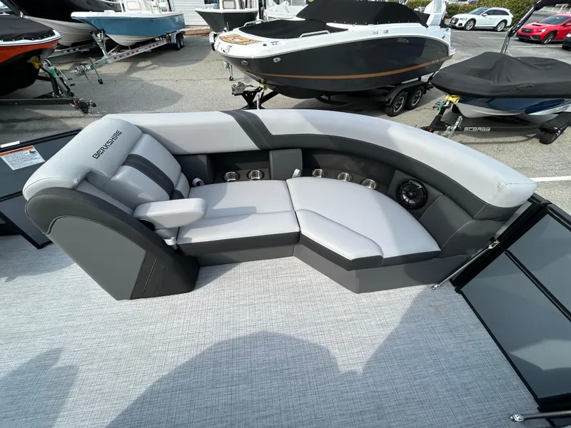 Slide: The Image of 2025 Berkshire 22RFX ARCH CTS 2.75 boat interior with gray seating and cup holders. - 10