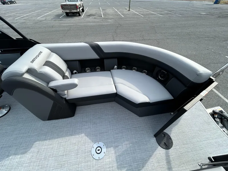 Slide: The Image of Luxurious seating on 2025 Berkshire 22RFX ARCH CTS 2.75 pontoon boat in a parking lot. - 12