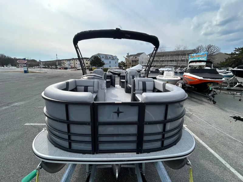 Slide: The Image of 2025 Berkshire 22RFX ARCH CTS 2.75 pontoon boat in a marina parking lot. - 3