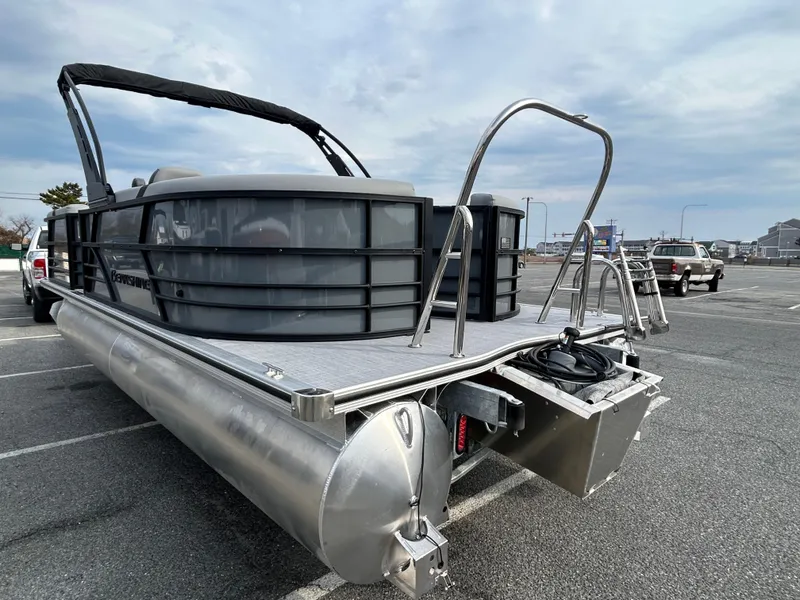Slide: The Image of 2025 Berkshire 22RFX ARCH CTS 2.75 pontoon boat in parking lot, rear view. - 6