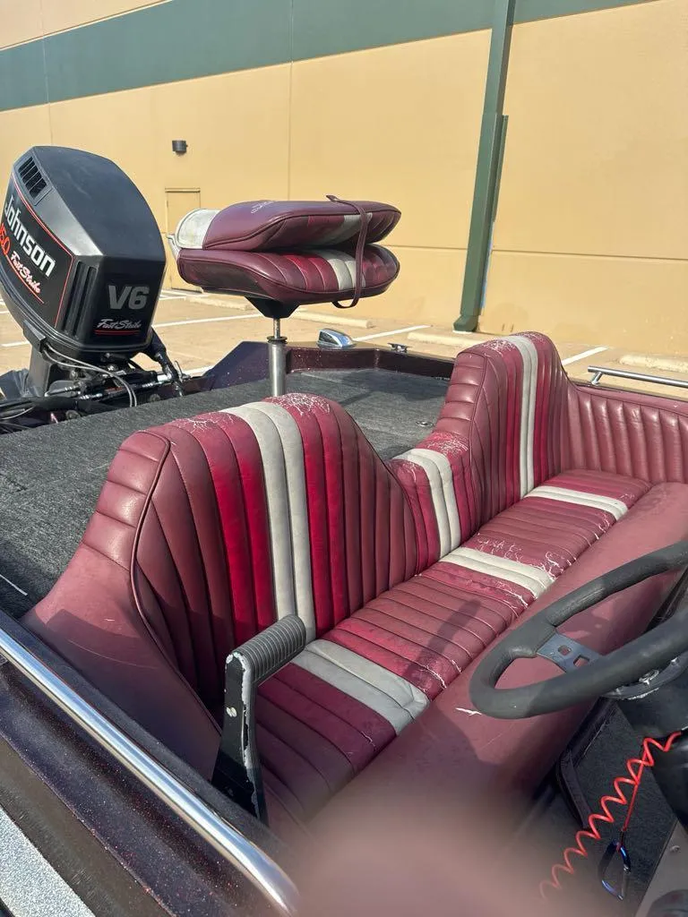 Slide: The Image of 1995 Ranger 372V boat with maroon and gray seats, Johnson V6 outboard motor. - 8